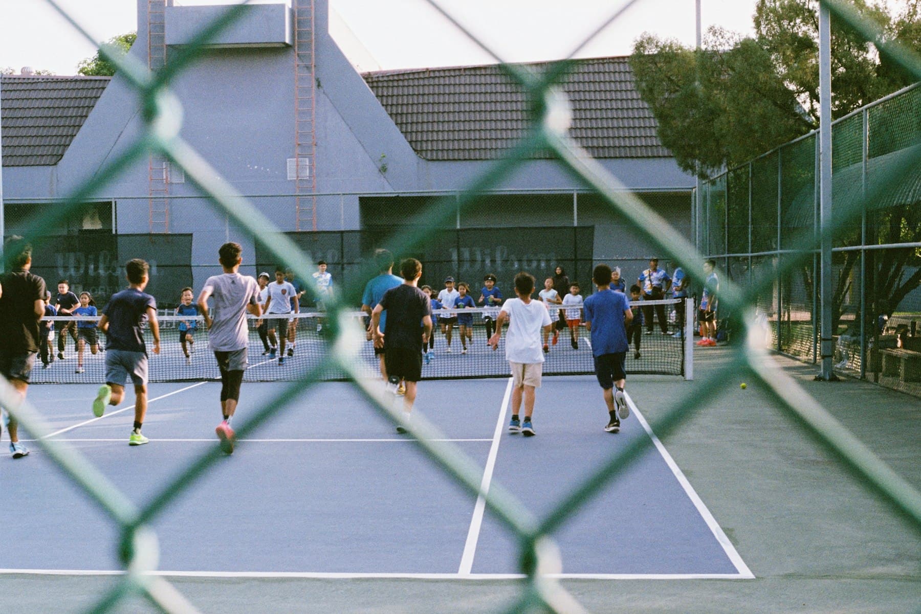 Kids running drills on a court